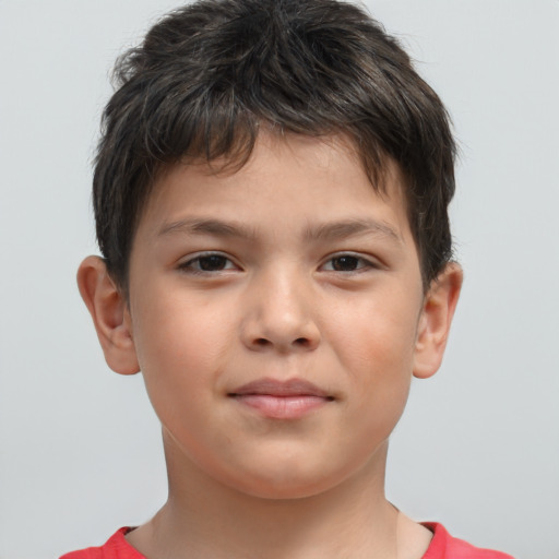 Joyful white child male with short  brown hair and brown eyes