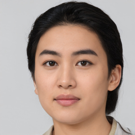 Neutral asian young-adult female with medium  black hair and brown eyes