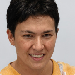 Joyful white adult female with short  brown hair and brown eyes