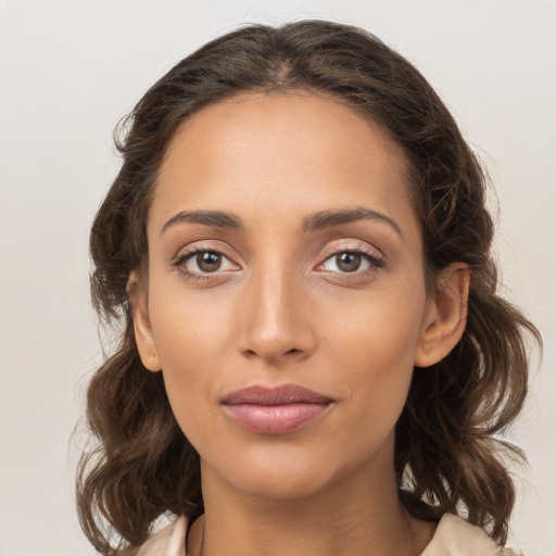 Joyful white young-adult female with medium  brown hair and brown eyes