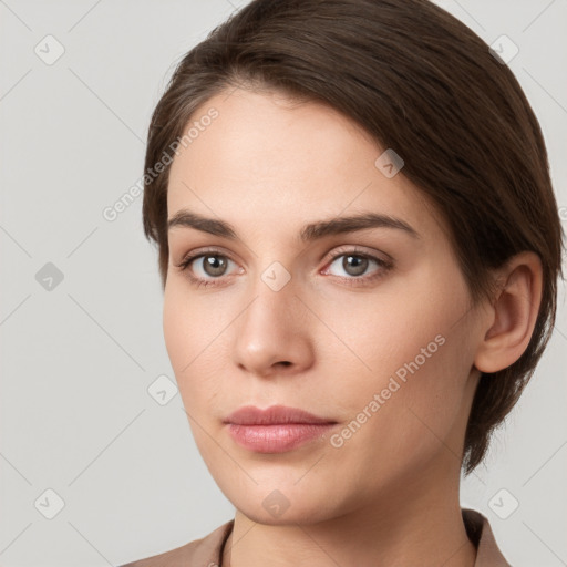 Neutral white young-adult female with medium  brown hair and grey eyes