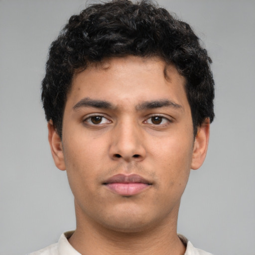 Neutral latino young-adult male with short  brown hair and brown eyes