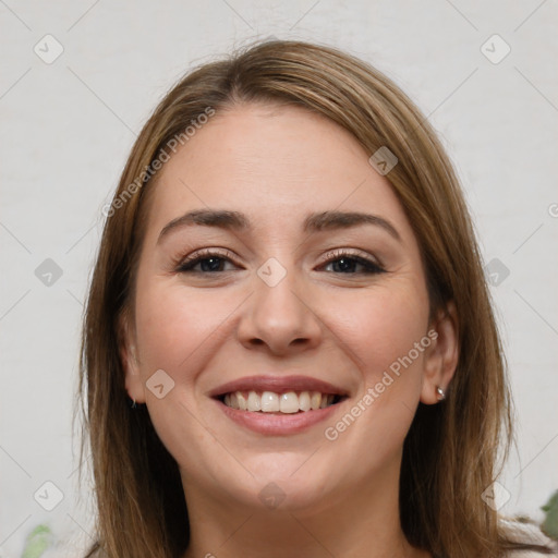 Joyful white young-adult female with long  brown hair and brown eyes