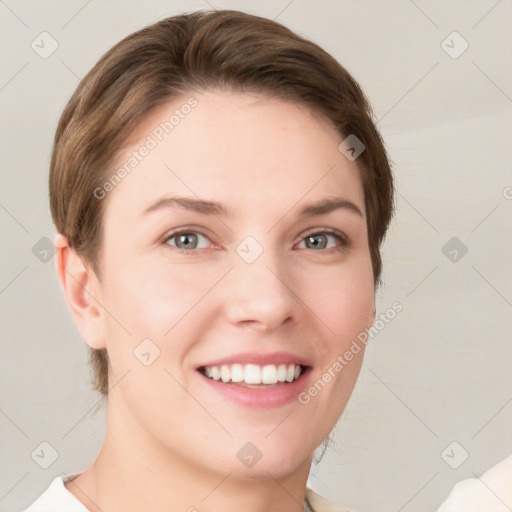 Joyful white young-adult female with short  brown hair and grey eyes