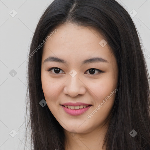 Joyful asian young-adult female with long  brown hair and brown eyes