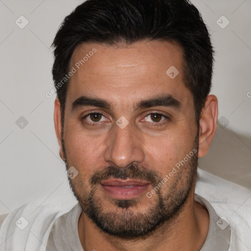 Joyful white adult male with short  brown hair and brown eyes