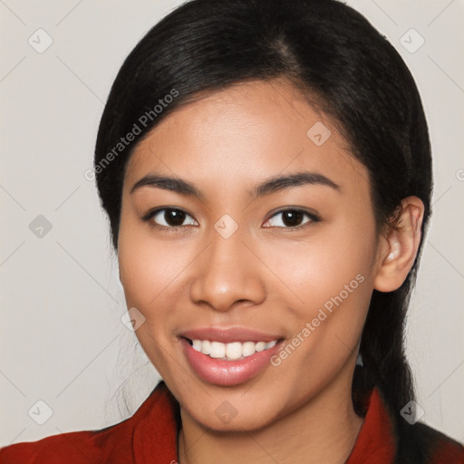 Joyful latino young-adult female with medium  black hair and brown eyes