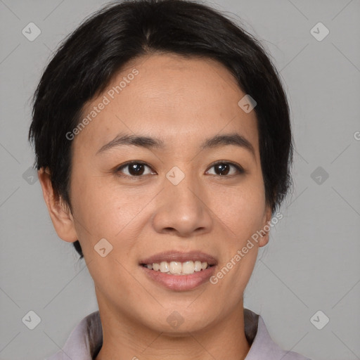 Joyful asian young-adult female with short  brown hair and brown eyes