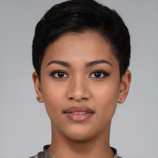 Joyful latino young-adult female with short  black hair and brown eyes