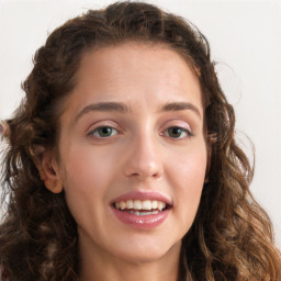 Joyful white young-adult female with long  brown hair and green eyes