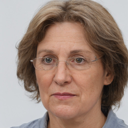 Joyful white middle-aged female with medium  brown hair and brown eyes