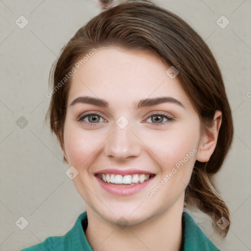 Joyful white young-adult female with medium  brown hair and green eyes