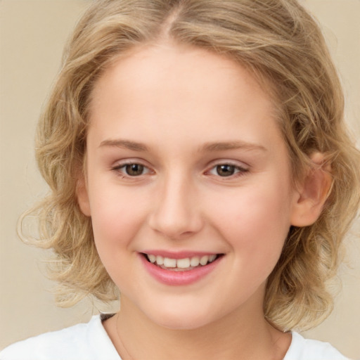 Joyful white child female with medium  brown hair and brown eyes