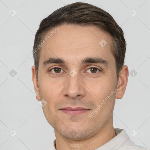 Joyful white adult male with short  brown hair and brown eyes