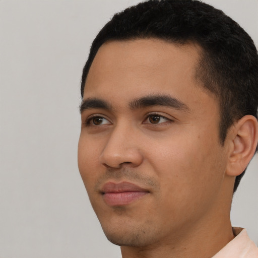 Neutral latino young-adult male with short  black hair and brown eyes