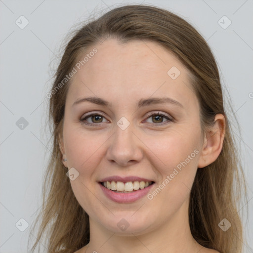 Joyful white young-adult female with long  brown hair and grey eyes