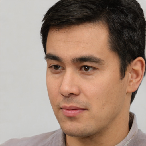Neutral white young-adult male with short  black hair and brown eyes