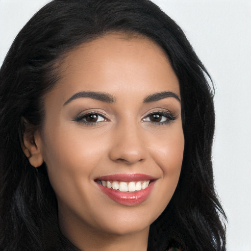 Joyful white young-adult female with long  black hair and brown eyes