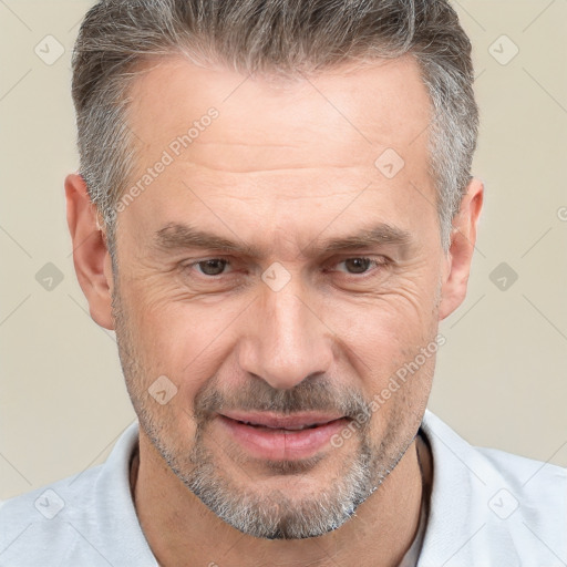 Joyful white middle-aged male with short  brown hair and brown eyes