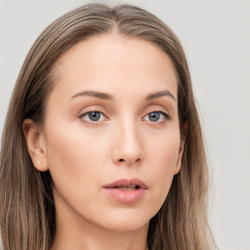 Neutral white young-adult female with long  brown hair and grey eyes