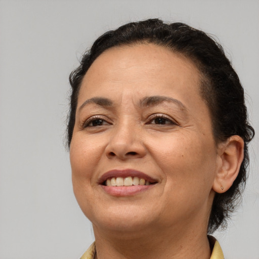 Joyful white adult female with short  brown hair and brown eyes