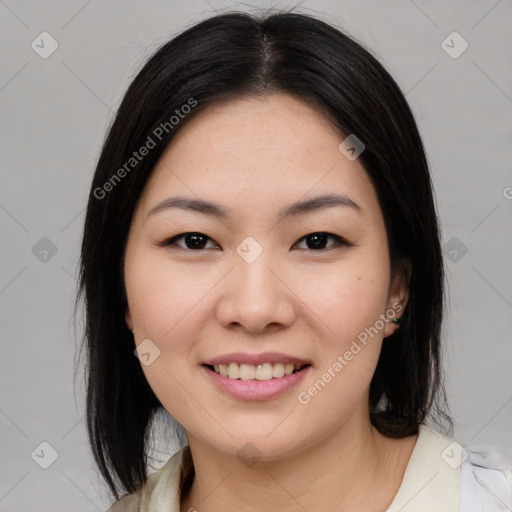 Joyful asian young-adult female with medium  black hair and brown eyes