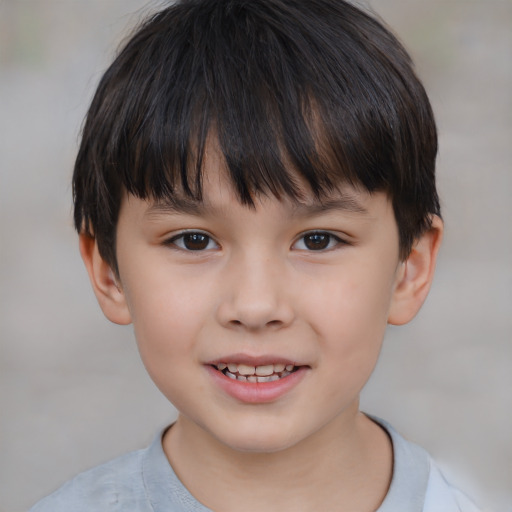 Joyful white child male with short  brown hair and brown eyes