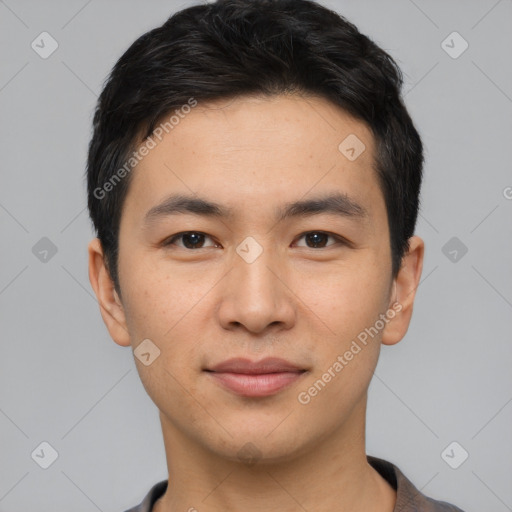 Joyful asian young-adult male with short  black hair and brown eyes