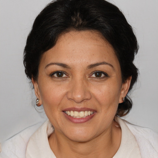 Joyful white adult female with medium  brown hair and brown eyes