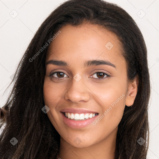 Joyful latino young-adult female with long  brown hair and brown eyes