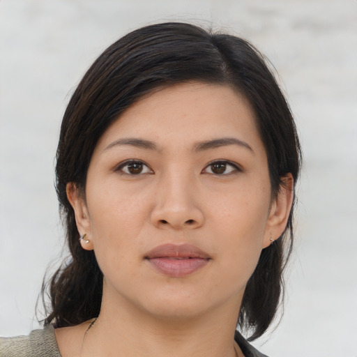 Neutral asian young-adult female with medium  brown hair and brown eyes