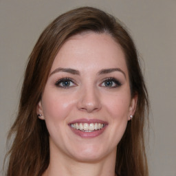 Joyful white young-adult female with medium  brown hair and brown eyes