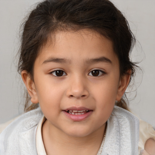 Joyful white child female with medium  brown hair and brown eyes