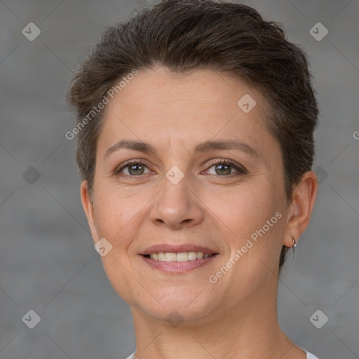 Joyful white adult female with short  brown hair and brown eyes