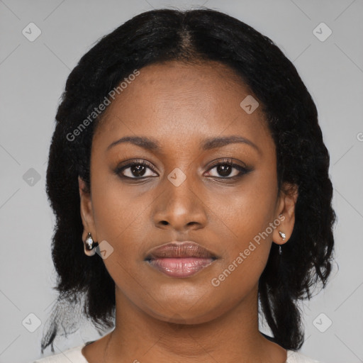 Joyful black young-adult female with medium  black hair and brown eyes