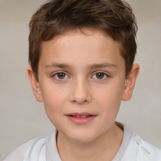 Joyful white child male with short  brown hair and brown eyes