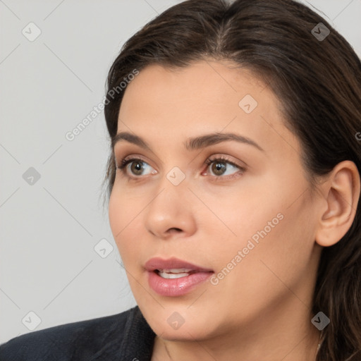 Neutral white young-adult female with long  brown hair and brown eyes