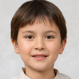 Joyful white child male with short  brown hair and brown eyes