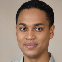 Joyful black young-adult male with short  black hair and brown eyes