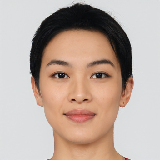 Joyful asian young-adult female with short  black hair and brown eyes