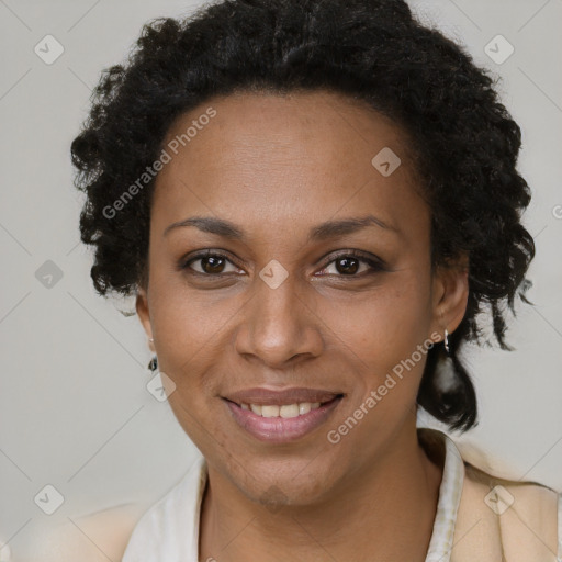 Joyful black adult female with short  brown hair and brown eyes