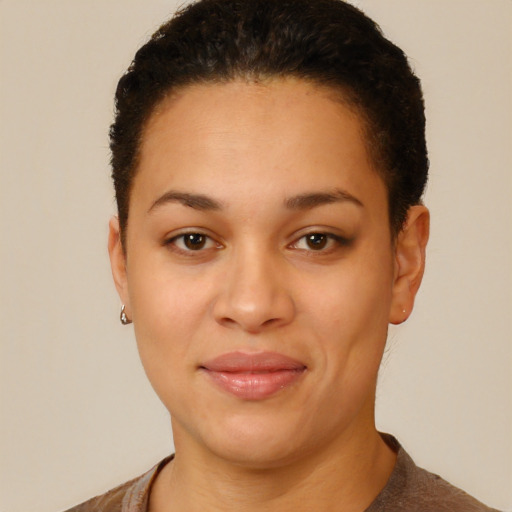 Joyful black young-adult female with short  brown hair and brown eyes