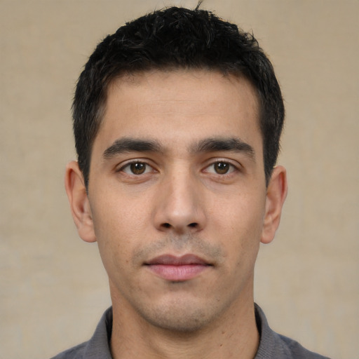 Neutral white young-adult male with short  black hair and brown eyes