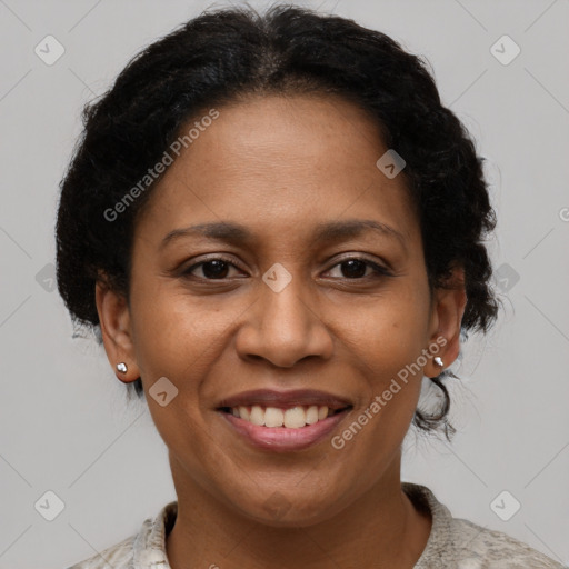 Joyful black adult female with short  brown hair and brown eyes