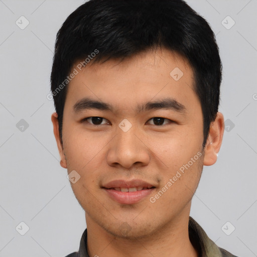 Joyful asian young-adult male with short  black hair and brown eyes