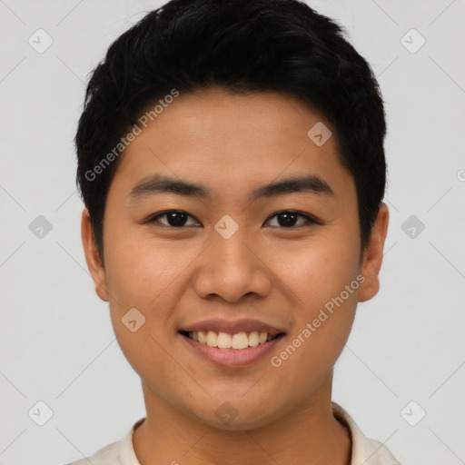 Joyful asian young-adult male with short  black hair and brown eyes