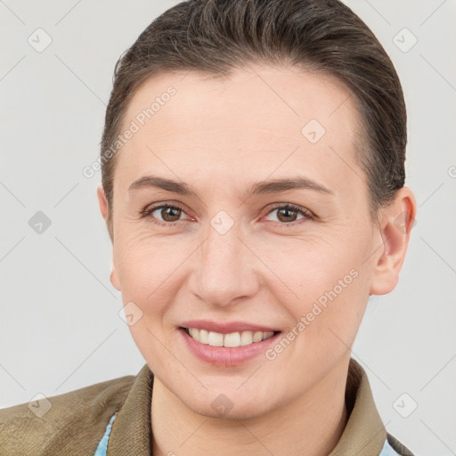 Joyful white young-adult female with short  brown hair and brown eyes