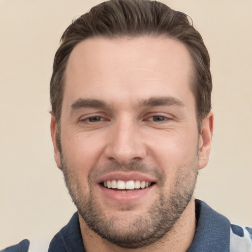 Joyful white young-adult male with short  brown hair and brown eyes