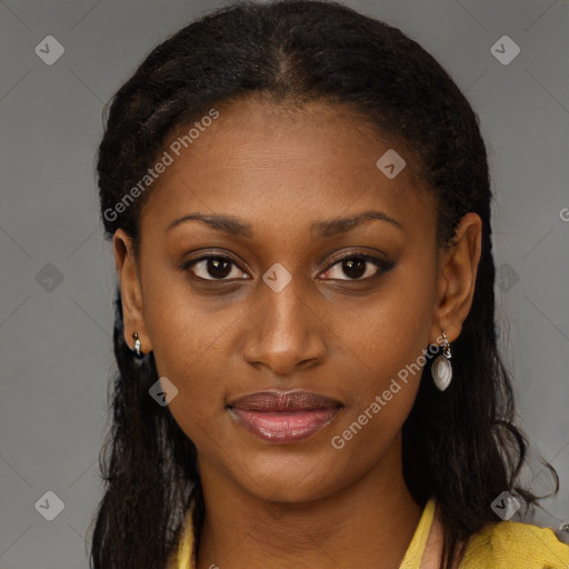 Joyful black young-adult female with long  brown hair and brown eyes