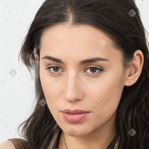 Neutral white young-adult female with long  brown hair and brown eyes